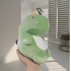 Soft Green Dinosaur Plush Toy with Pink Accents & Floral Accents