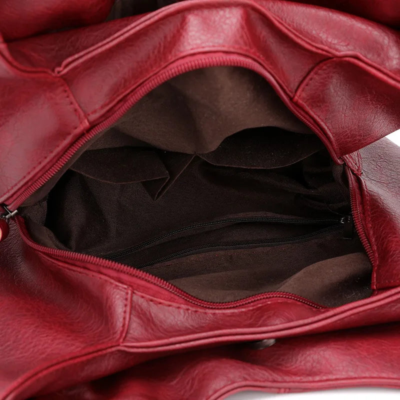 Women's Leather Crossbody Bag with Tassel Detail