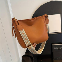 Minimalist Solid Shoulder Bag with Geometric Pattern Strap