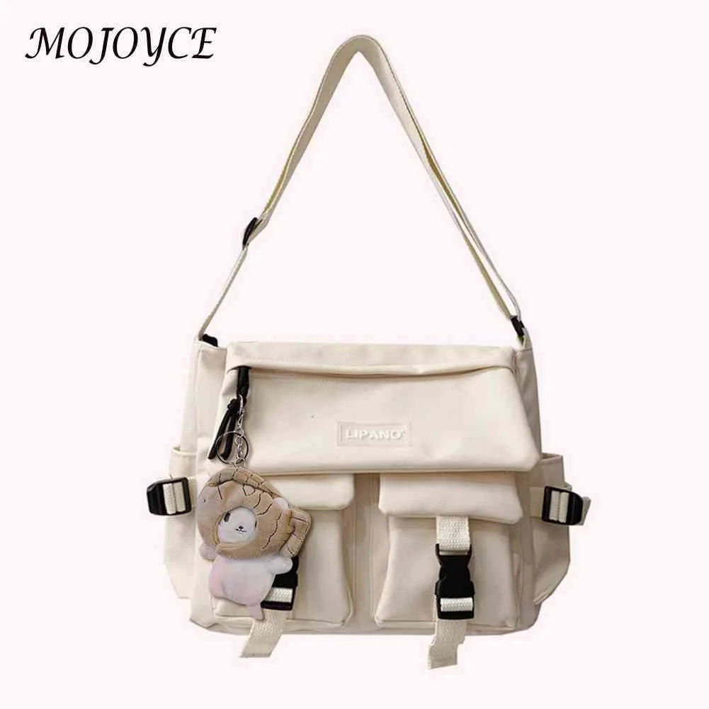 Women's Crossbody Bag with Pockets and Pendant - Zipper Closure