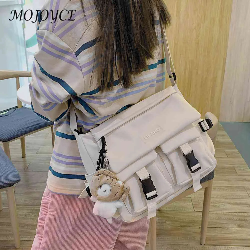 Women's Crossbody Bag with Pockets and Pendant - Zipper Closure