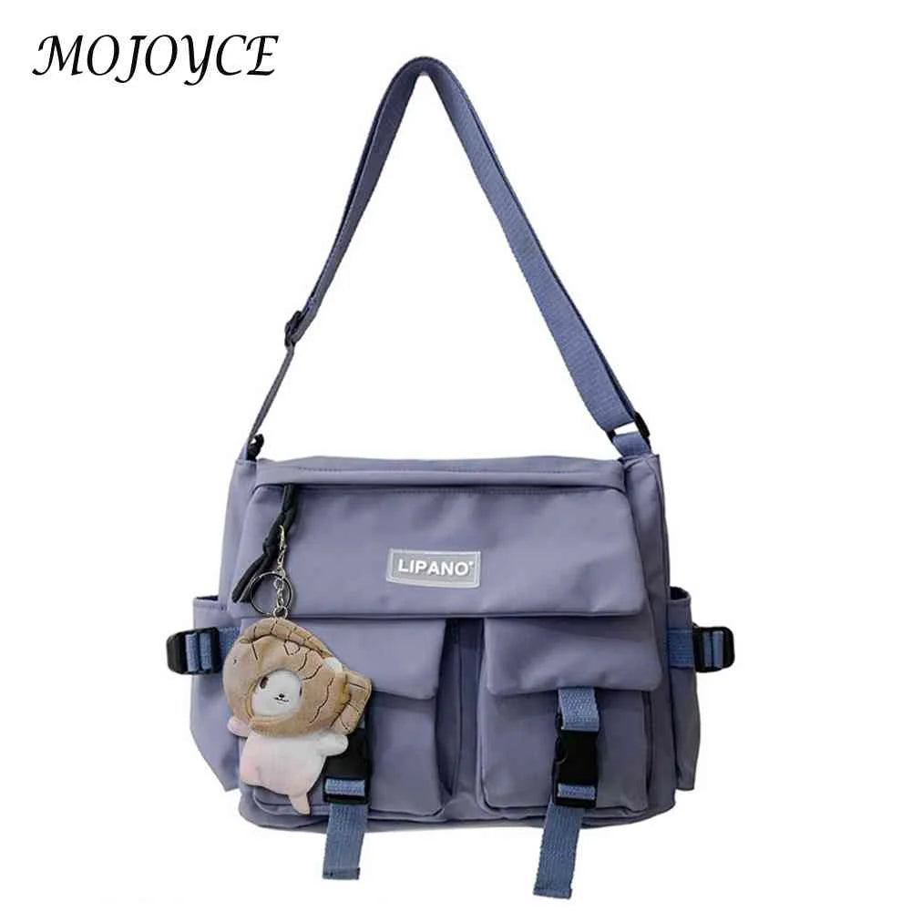 Women's Crossbody Bag with Pockets and Pendant - Zipper Closure