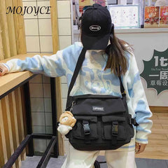 Women's Crossbody Bag with Pockets and Pendant - Zipper Closure